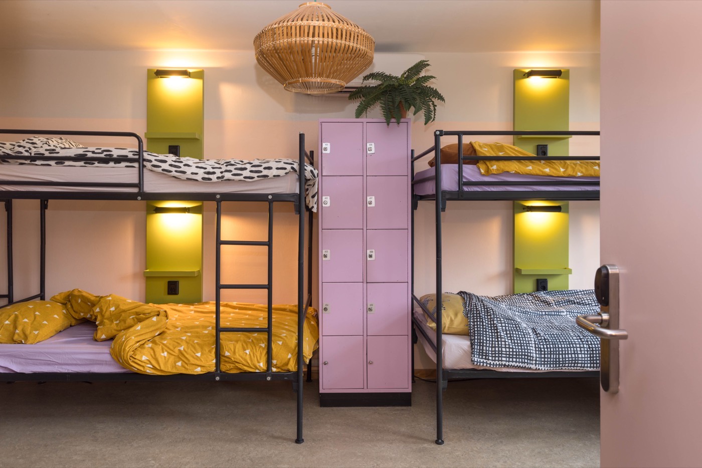 Group dorm with bunk beds and private lockers