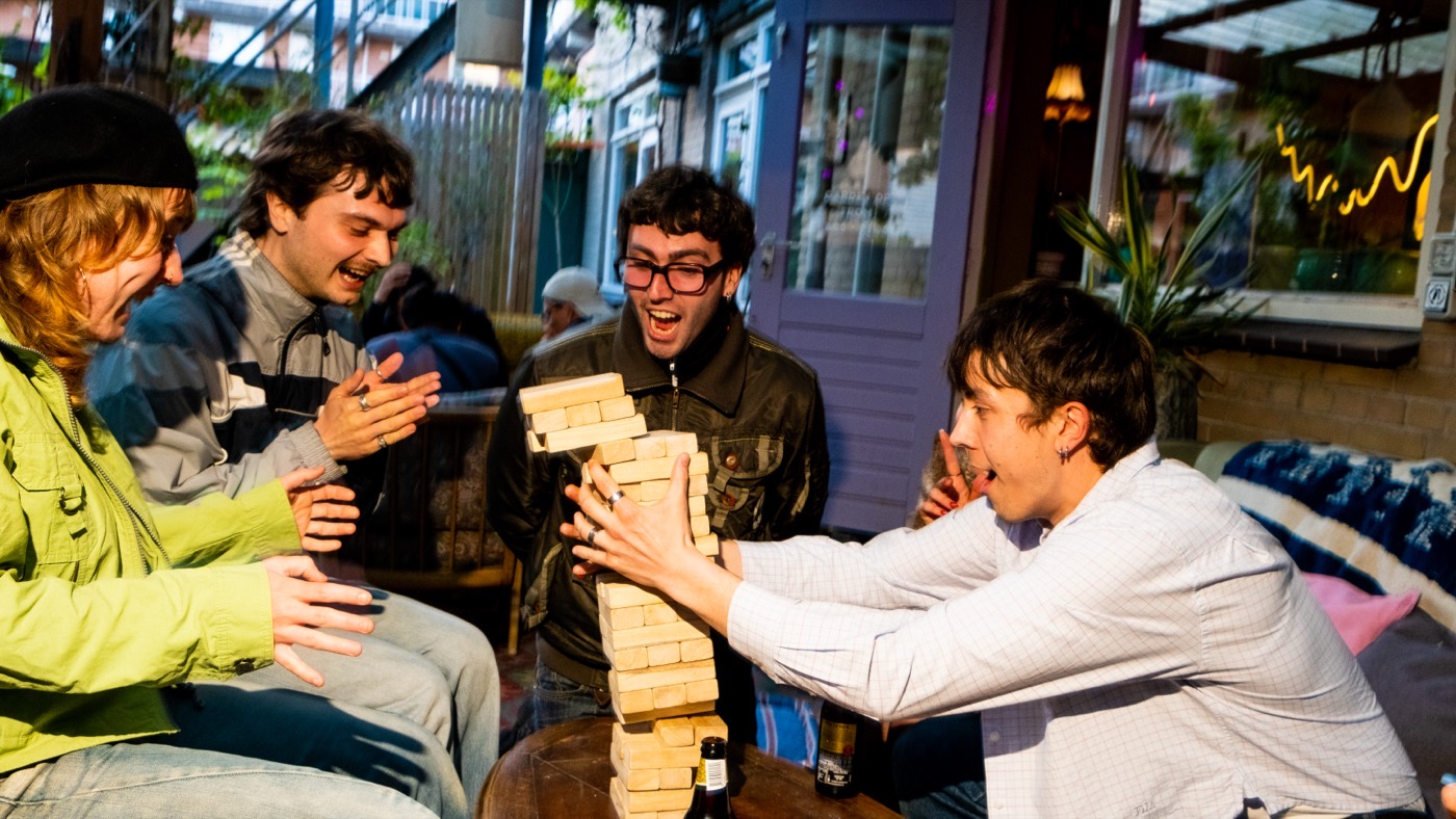 Group playing games outside in the garden at night