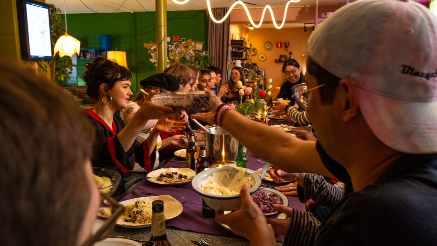 Student group sharing a big dinner together