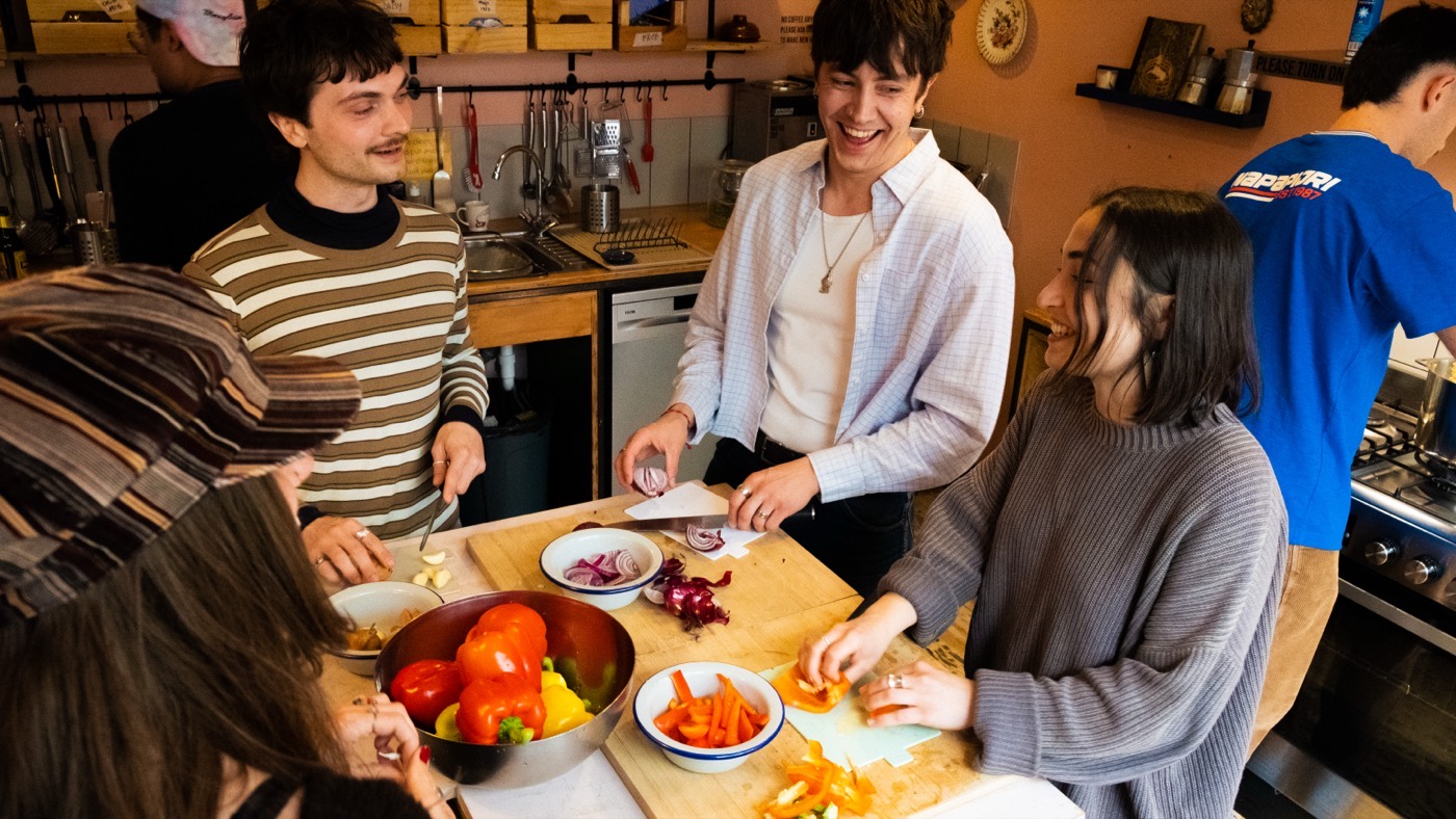 Students cooking together in the shared kitchen