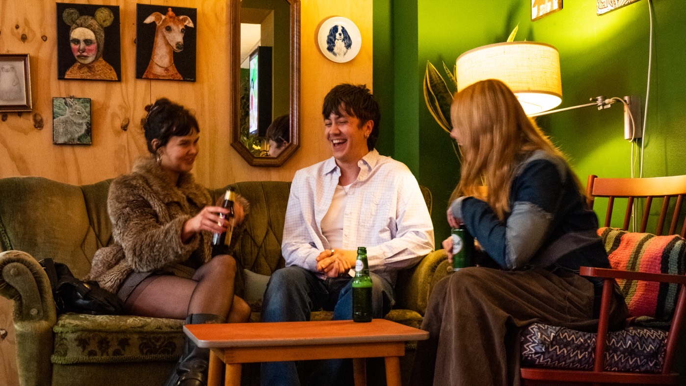 Friends sharing drinks in the lounge